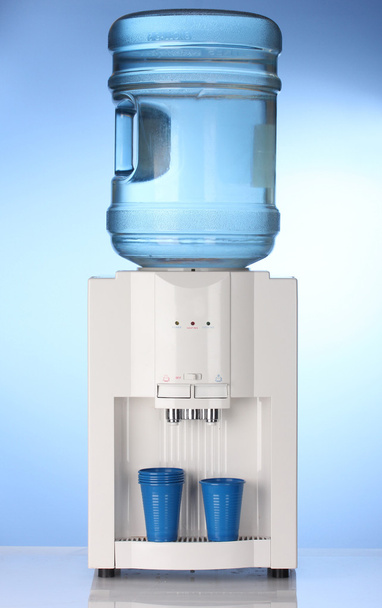 Electric water cooler on blue background - Foto, immagini