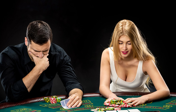 Poker players sitting at poker table and going all-in - Foto, imagen