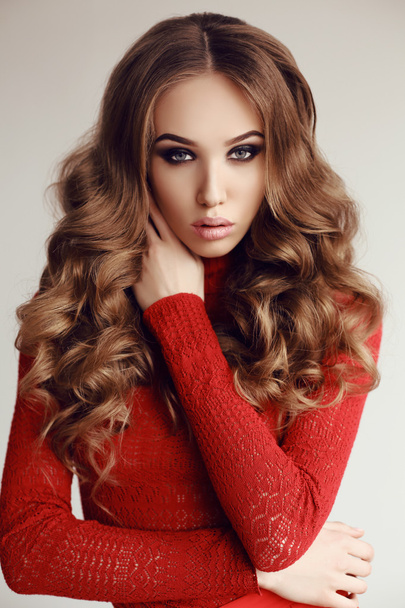 beautiful young woman with dark hair in elegant red dress   - Φωτογραφία, εικόνα
