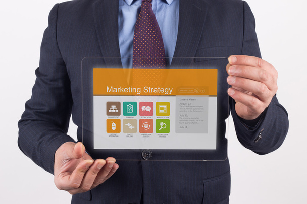 Businessman holding transparent tablet pc - Foto, Imagen