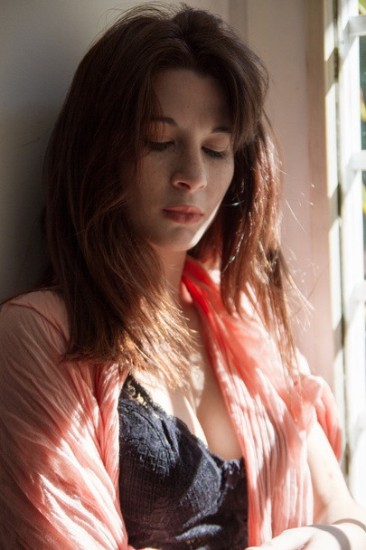 Sunlit freckled woman, wearing underwear and a pink pashmina sca - Photo, Image