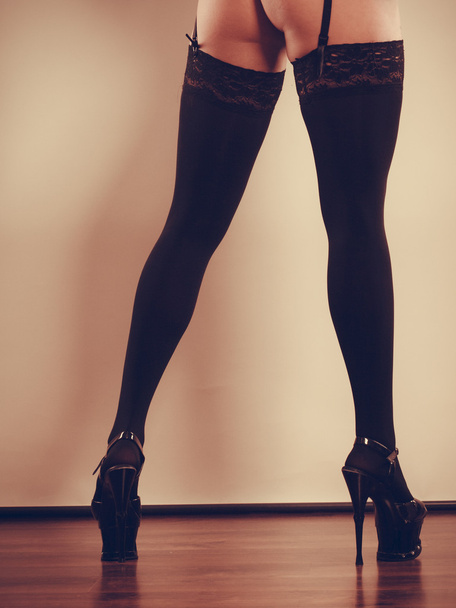 Sexy long female legs in black. - Φωτογραφία, εικόνα
