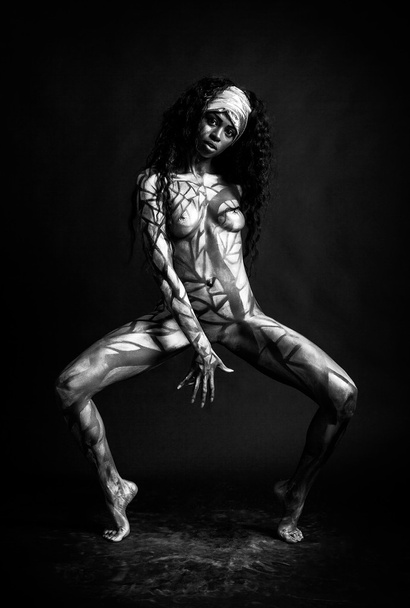 Sensual african model body painted with polygons black and white - Fotó, kép