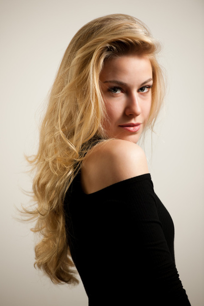 Beautiful young woman with gorgeous hairstyle posing  over white - Foto, immagini