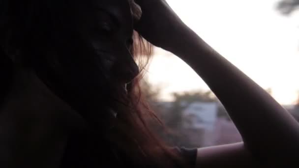 Young Girl Looking out from Car Window Sunset - Video, Çekim