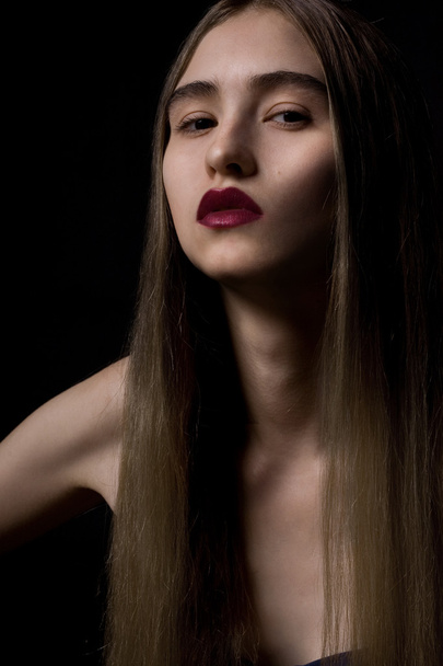 Closeup portrait of a serious model with makeup - Фото, изображение