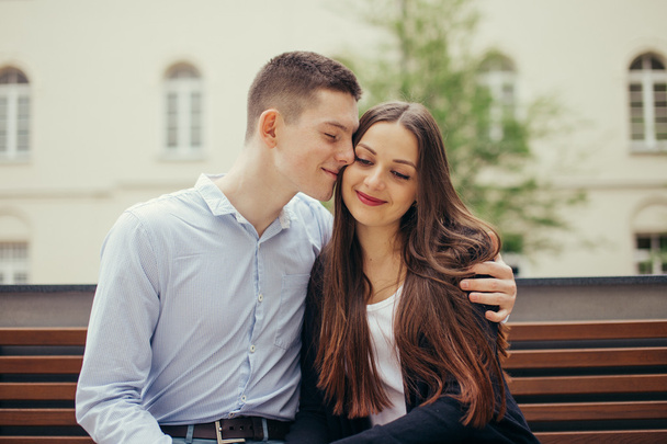 Lovely couple sitting in the park background - Photo, image