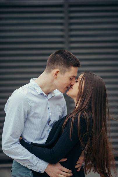 Lovely couple standing on the street and kissing - Foto, immagini