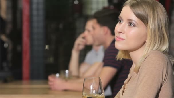 Close up of a blonde girl drink wine - Felvétel, videó