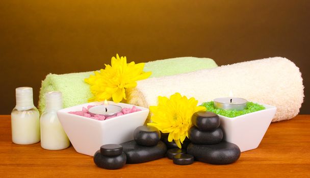 Spa setting on wooden table on brown background - Foto, immagini