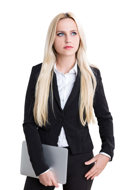 Thoughtful caucasian businesswoman with laptop in hand isolated on white background - 写真・画像