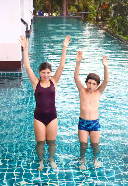 girl and boy competition swimming pool - Photo, Image