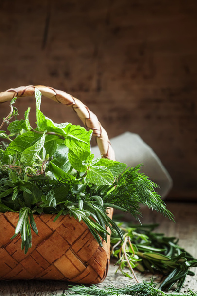 Spicy herbs in a wicker basket  - Foto, Imagem
