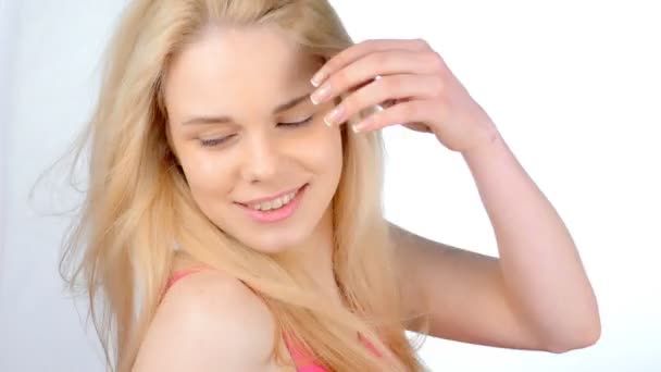   Blonde girl posing, flirting on a white background - Footage, Video