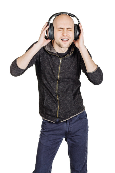 man listening to music in headphones - Fotó, kép