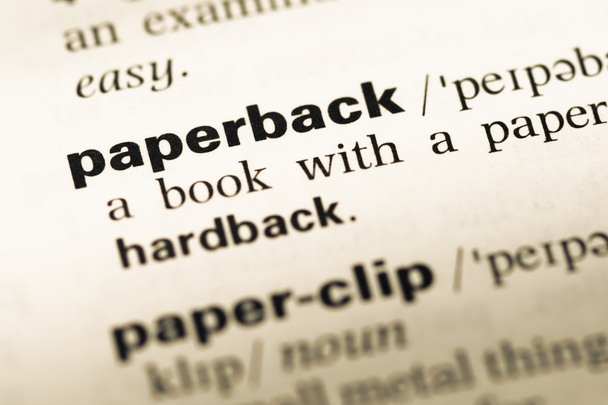 Закрыть страницу старого английского словаря со словом paperback
 - Фото, изображение