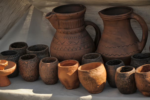 Self-made pottery ( jug, kettle, pot, cover, Jug) decorated by old. - Foto, imagen