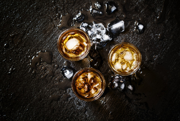 Cold whiskey in glasses with crushed ice  - Fotó, kép