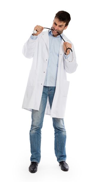 Humorous portrait of a young depressed surgeon with a stethoscop - Foto, Bild