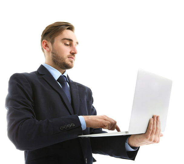 Young man in suit using laptop - Foto, Imagem