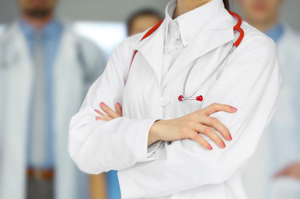 female doctor standing in front of the colleagues - Φωτογραφία, εικόνα
