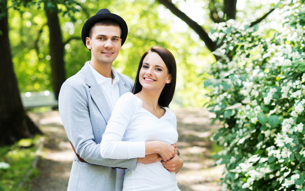 Young beautiful couple posing in the park - Foto, Imagen