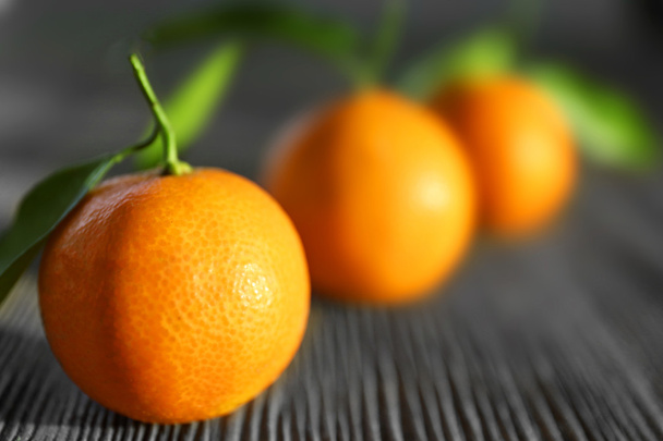 Fresh tangerines with leaves - 写真・画像