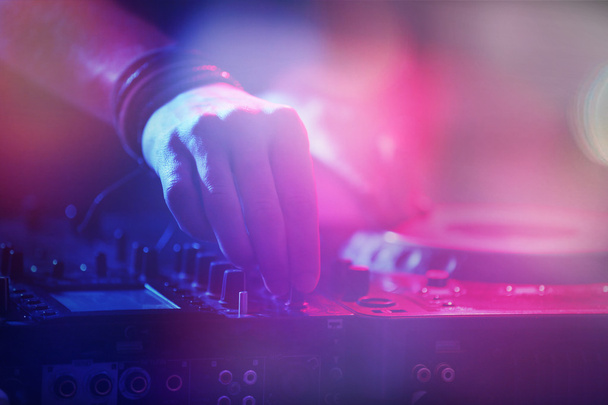 DJ playing music at mixer closeup - Foto, Imagen