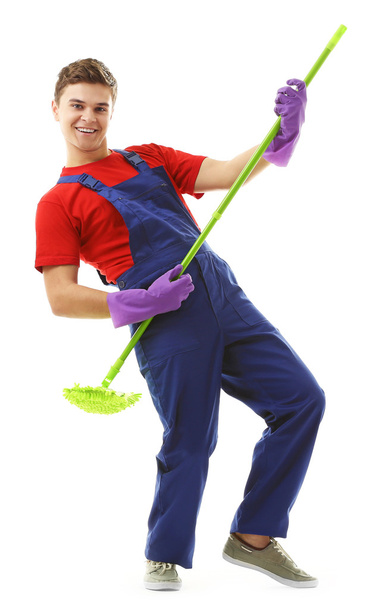 Young janitor with floor brush  - Foto, Bild