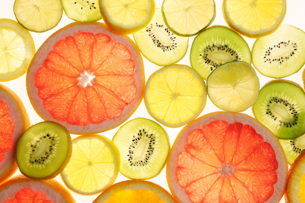 Fresh sliced citrus background - Zdjęcie, obraz