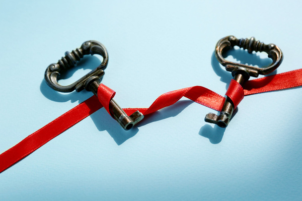Vintage key with a red ribbon - Фото, изображение