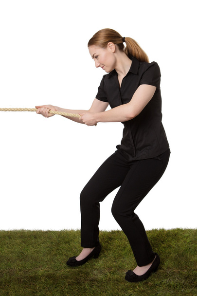 woman pulling a rope tug of war - Photo, Image