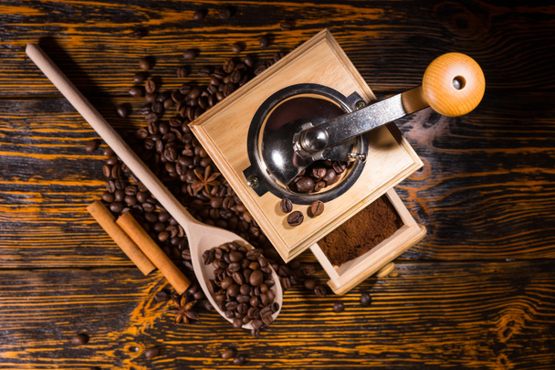 Top down view on coffee grinder and spoon - Φωτογραφία, εικόνα