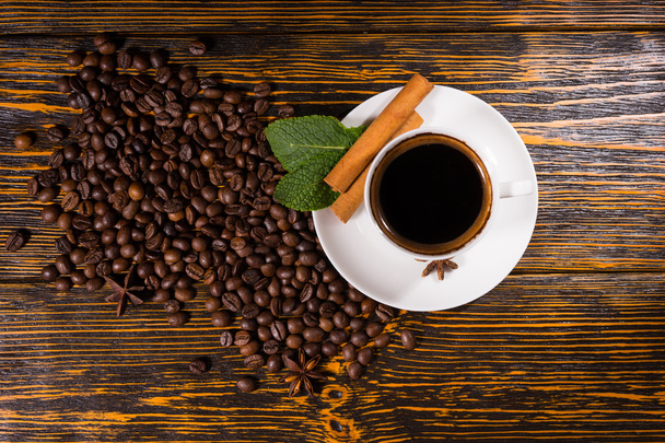 Background composed of coffee beans on wood table - Photo, Image