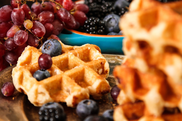 Home made Belgian waffles with fresh berries and grapes on rusti - Fotografie, Obrázek