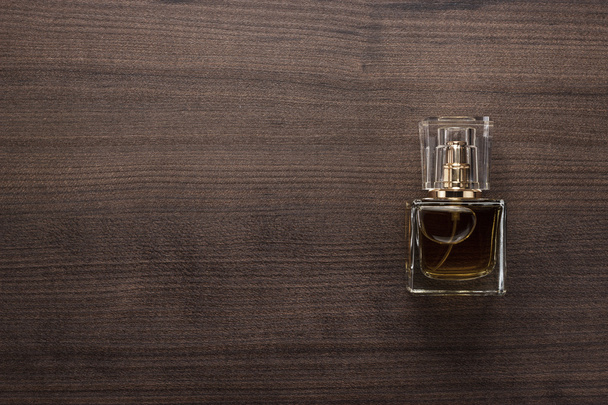 perfume bottle on the wooden table - Foto, imagen