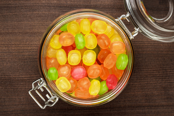 glass jar full of colorful sweets - Fotó, kép