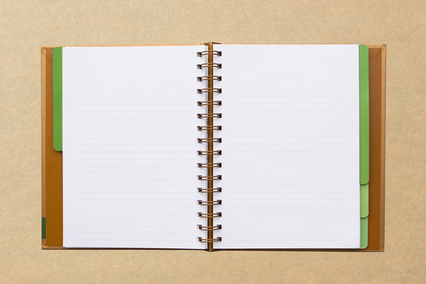 Open notebook with lined pages isolated on board background. - Photo, Image