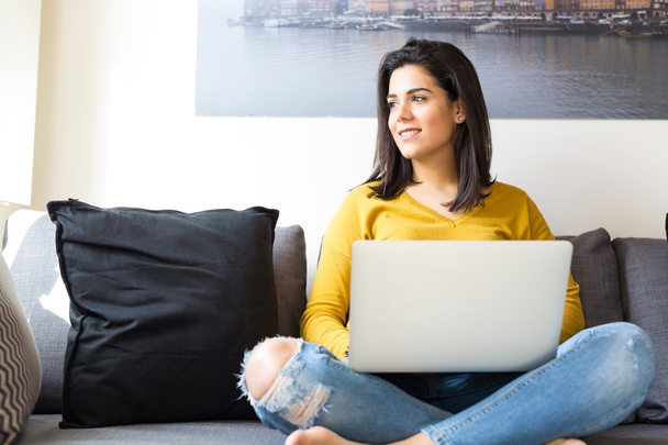 Woman relaxing with a laptop  - Photo, Image