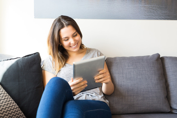 Woman relaxing with digital tablet - Photo, image
