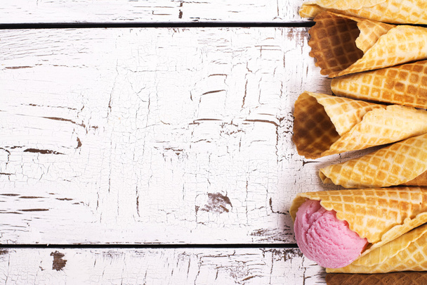 Wafer cones over white wooden table - Foto, afbeelding