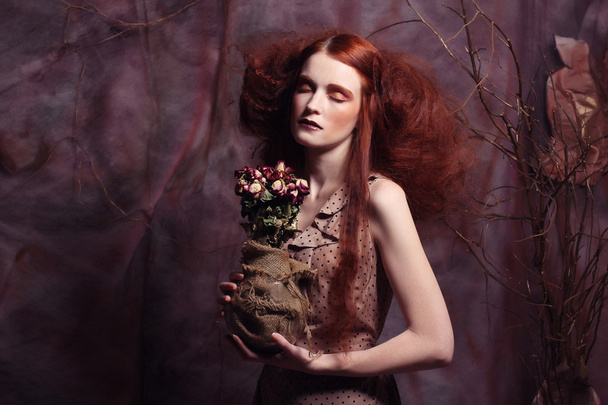 beautiful girl with dry roses - Zdjęcie, obraz