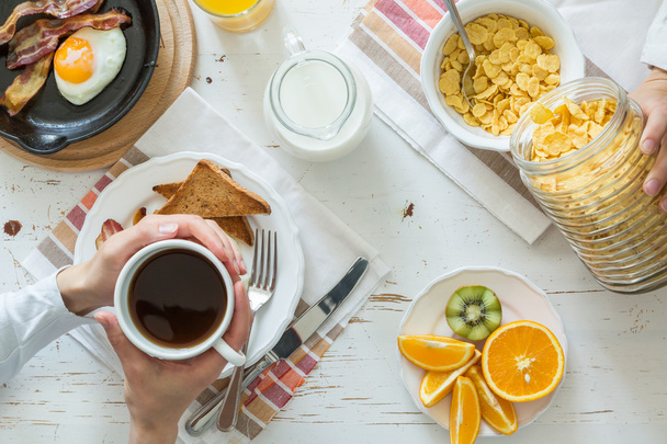 Family eating american breakfast - Фото, изображение