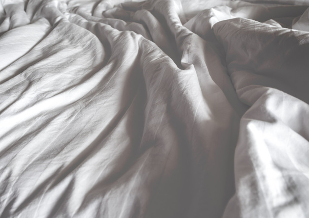 Messy white bed and two pillow, in the morning.Vintage filter. - Valokuva, kuva
