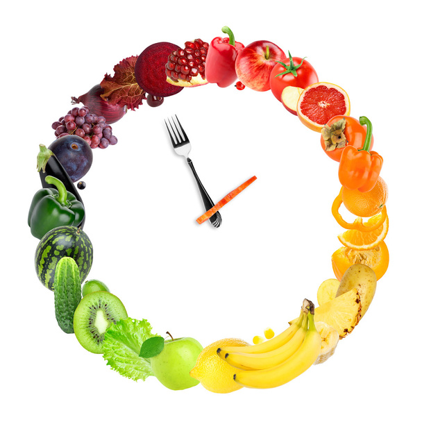 Futteruhr mit Obst und Gemüse - Foto, Bild