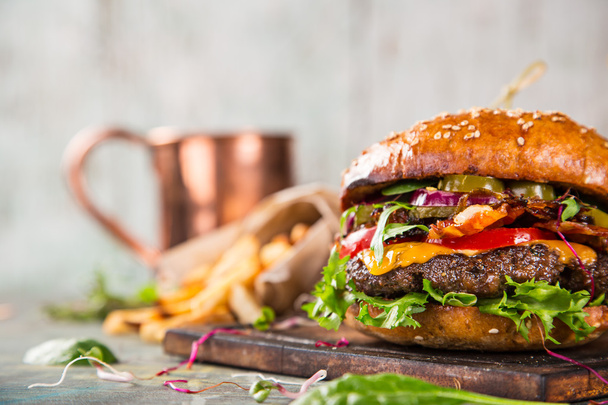 Tasty burgers on wooden table. - Foto, Imagen