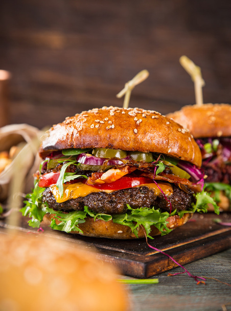 Tasty burgers on wooden table. - Valokuva, kuva