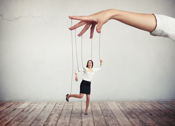Woman looks like a puppet on strings - Photo, Image