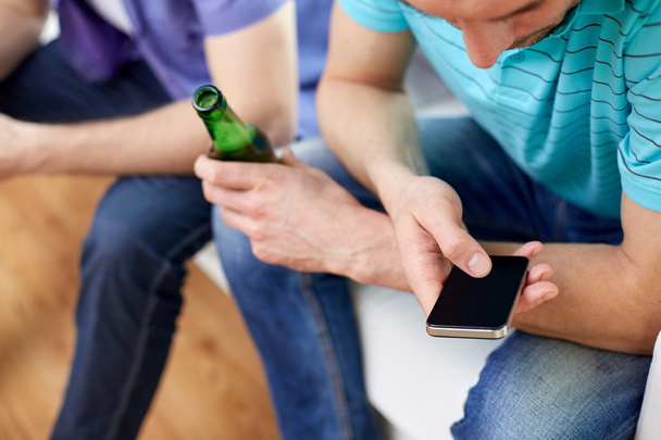 close up of man with smartphone and beer at home - Φωτογραφία, εικόνα