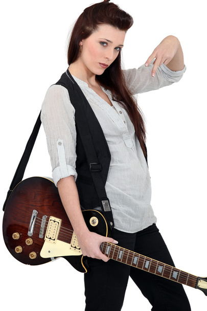 Portrait of a female guitarist - 写真・画像